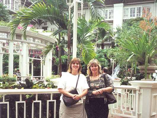 Owner Sara and Agent Hess enjoy the indoor Atrium at the Grand Old Oprey Hotel