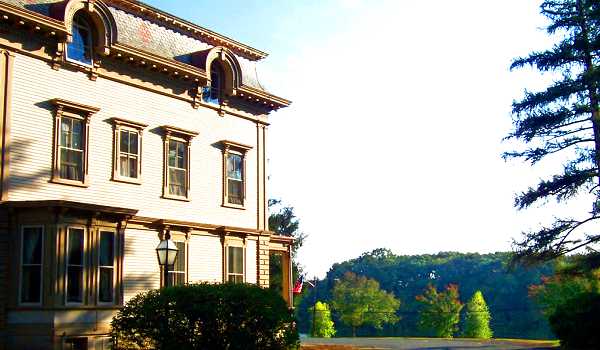 A view of side and grounds.