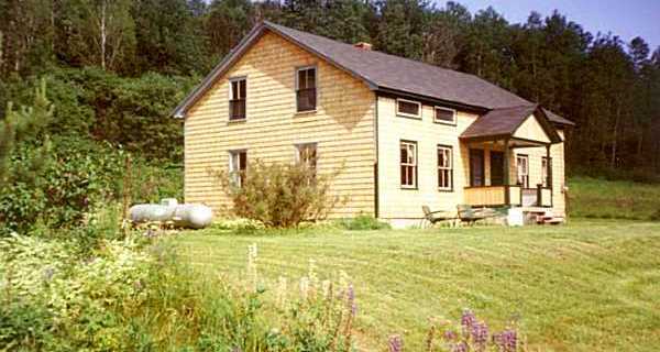 Two Family Cedar Cape. A new metal roof has been installed since this photo.
