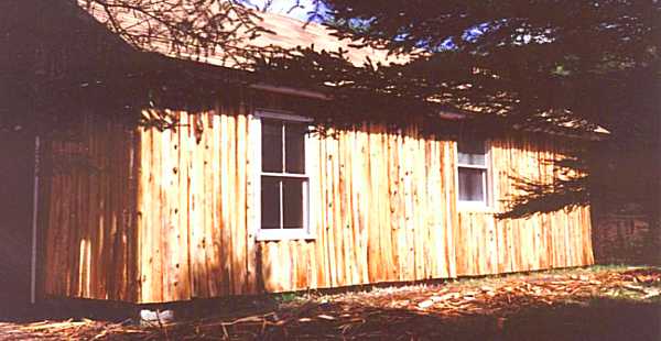 The tidy little cabin across the river.
