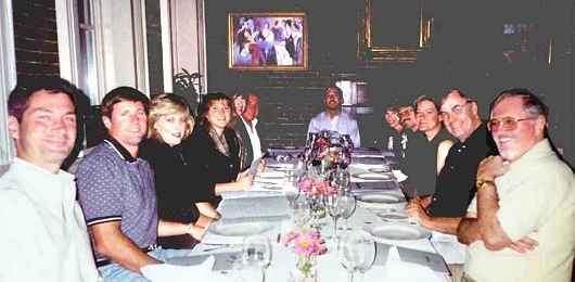 The staff and a few spouses enjoy a casual dinner out at the end of the day