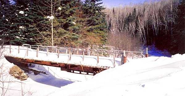 The bridge across the small brook.