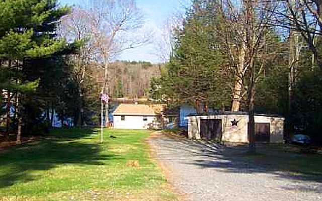 More back of home, garage and driveway.