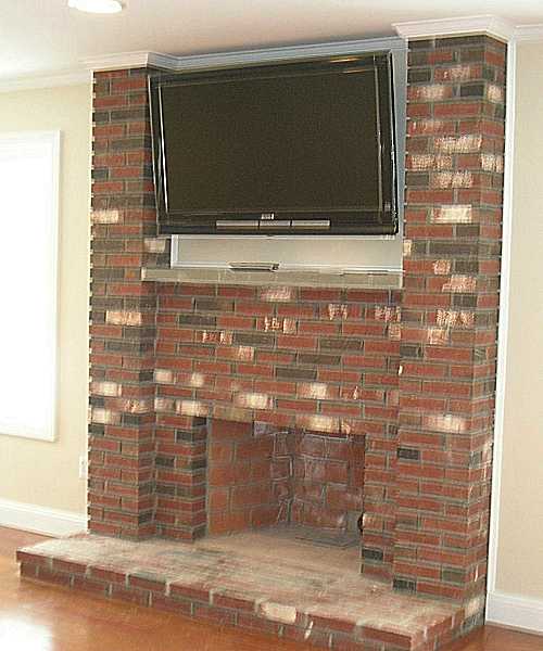 The family room fireplace with console.